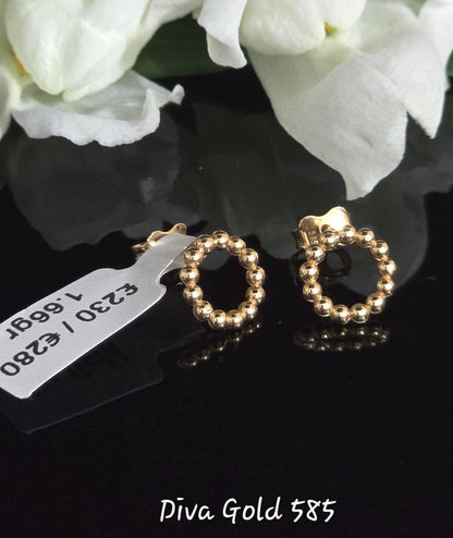 Stud gold earrings.