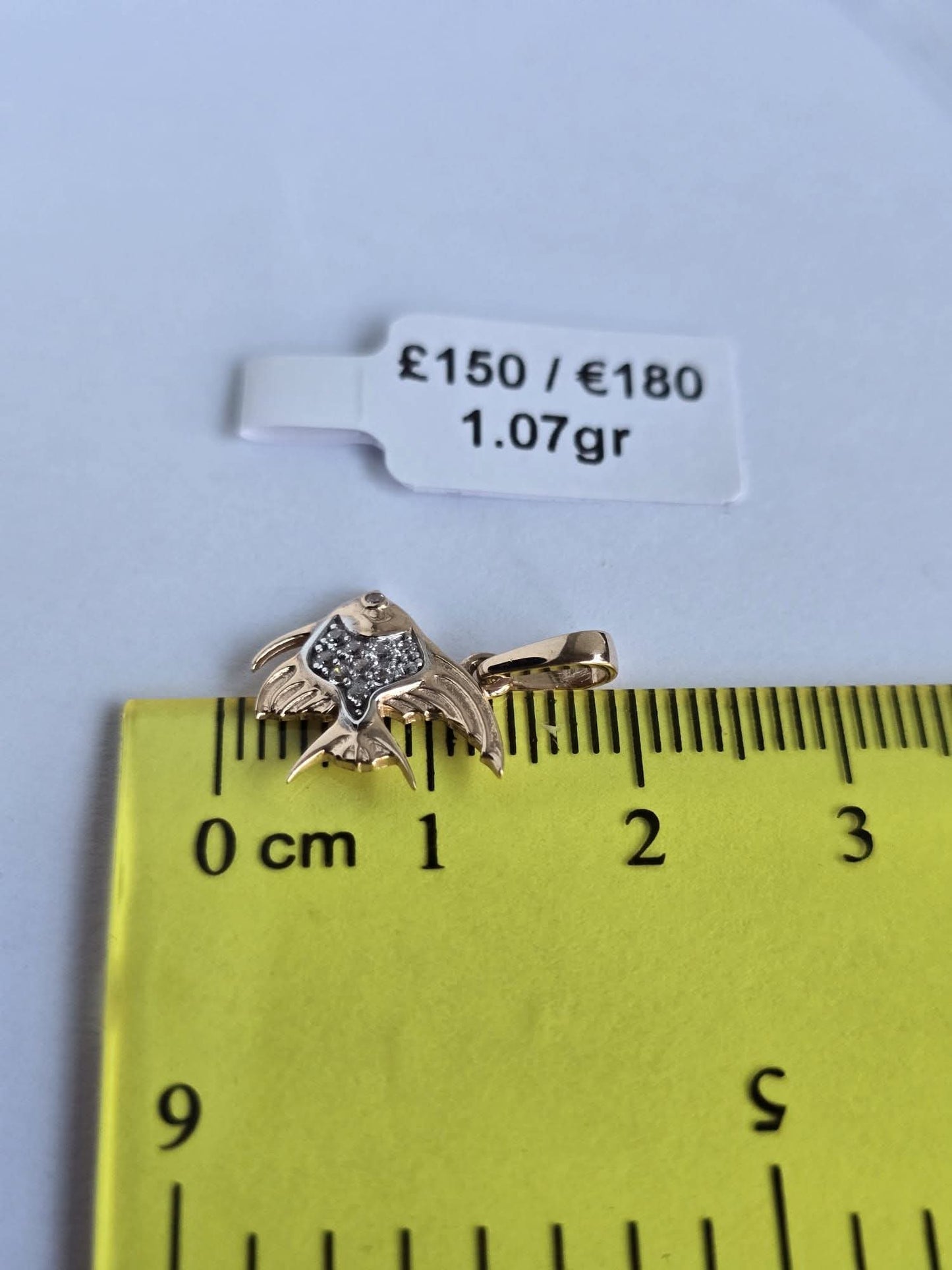 Golden zodiac fish. 1.07gr