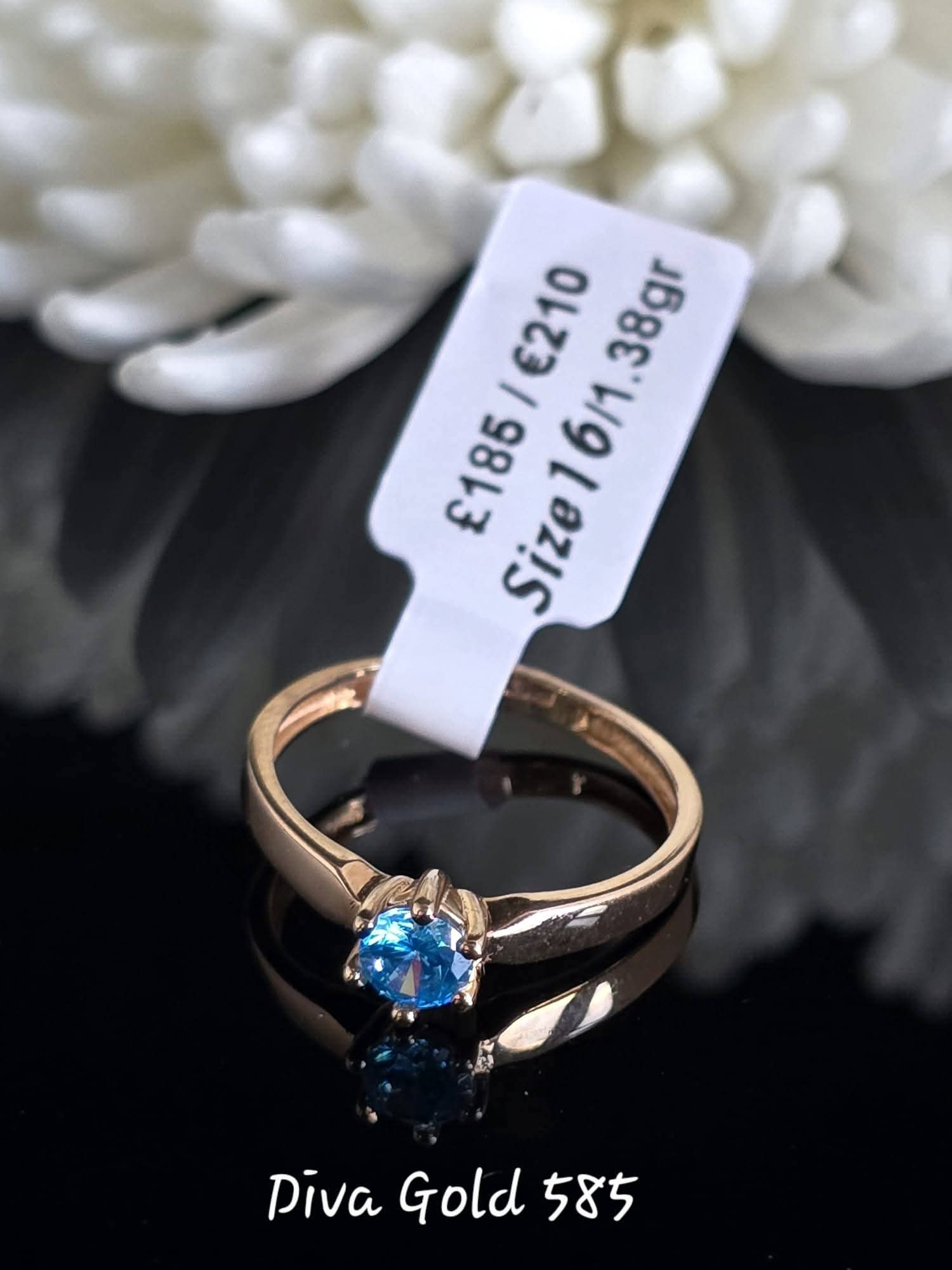 Gold women ring. Blue zircon stone. Size 16