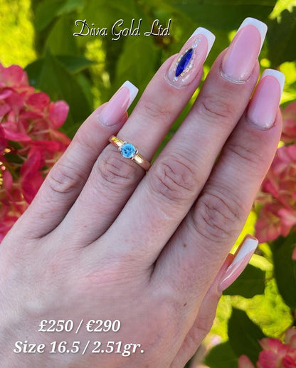 Gold ring with blue zircon stone. Size 16.5