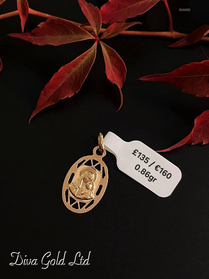 585 Gold medallion pendant. 0.86gr