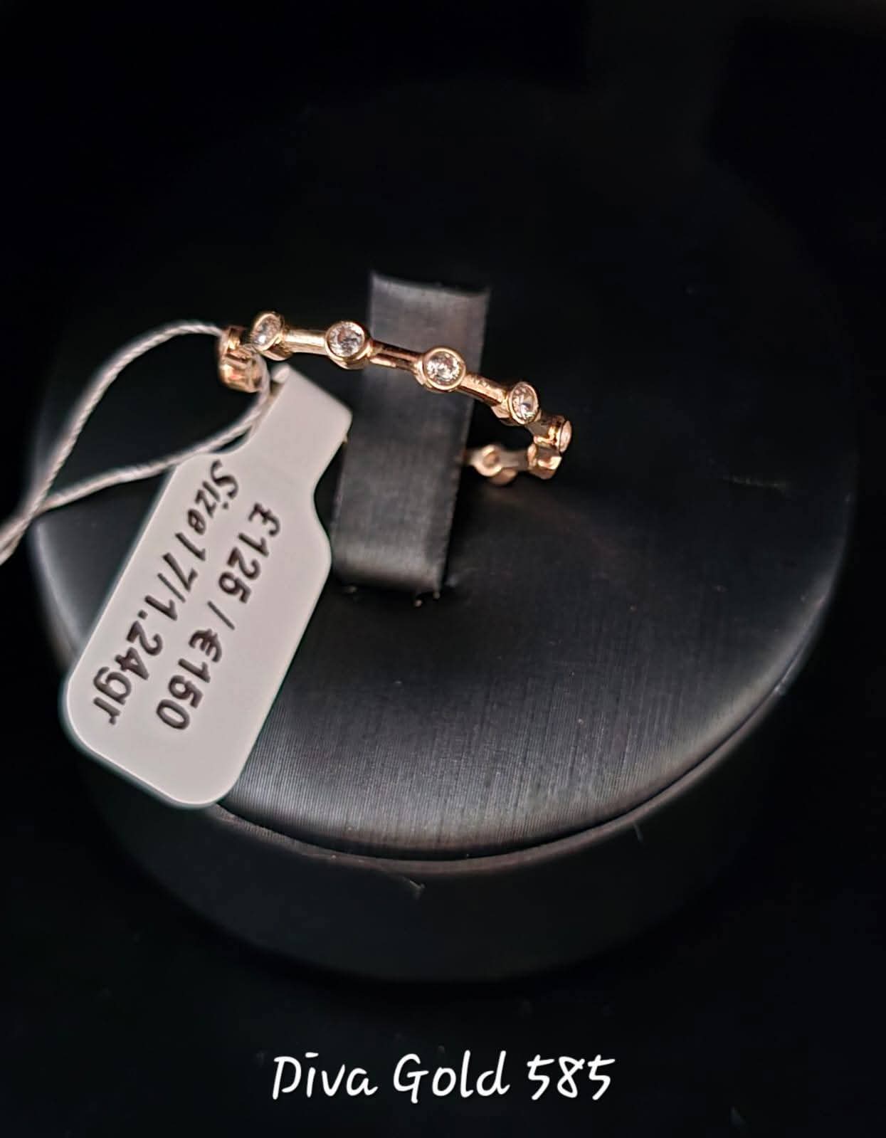 Gold ring with white zircon stones. Size 17