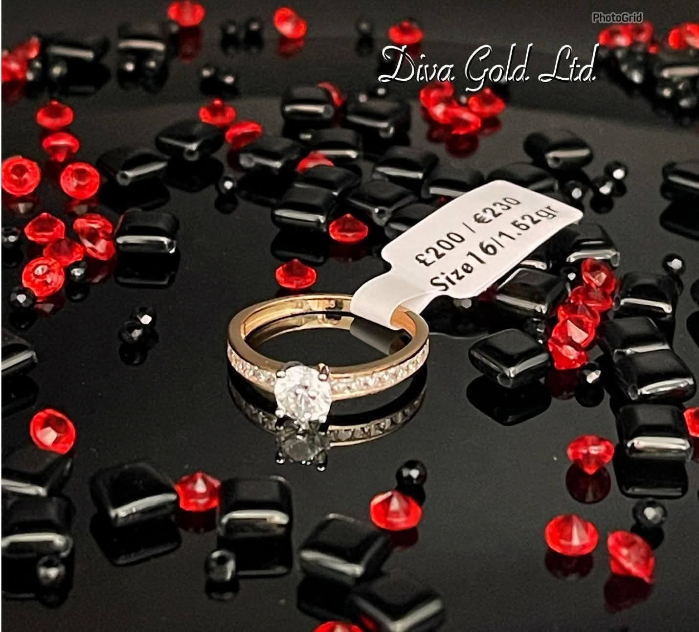 Gold women ring. White zircon stones.Size 16