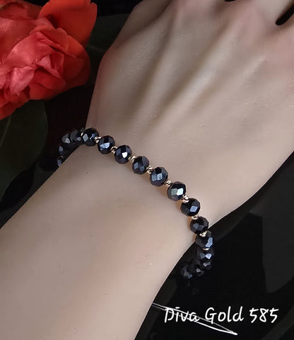 black thread bracelet with 585 gold details / blue beads