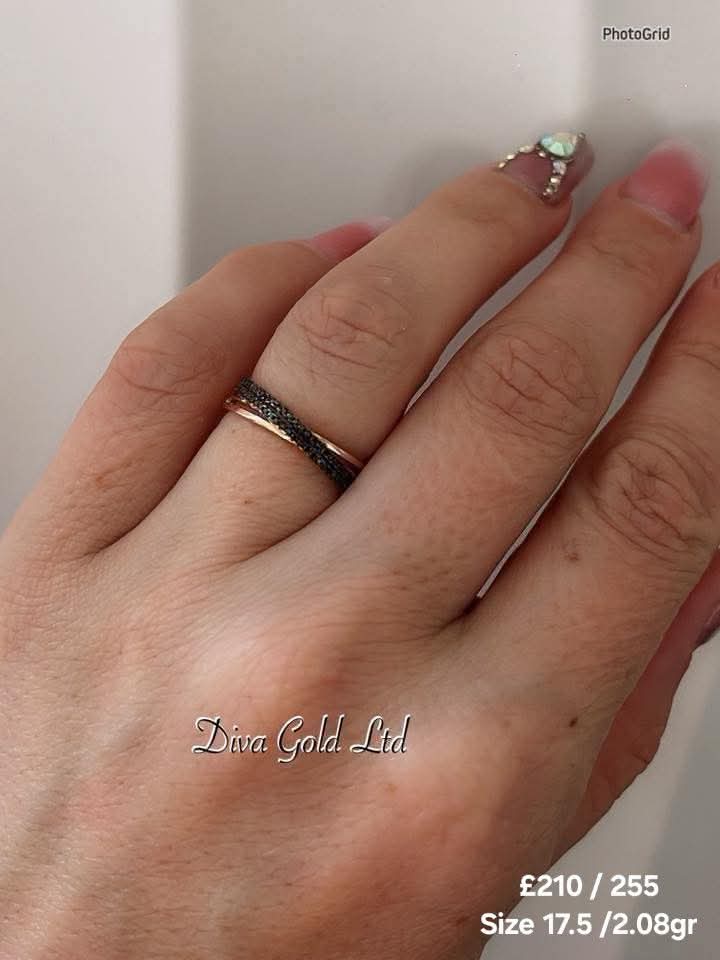 Gold ring with black zircon stones.  Size 17.5