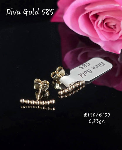 Stud gold earrings.