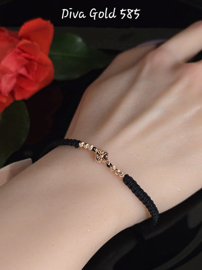 Clover thread bracelet with 585 gold details.