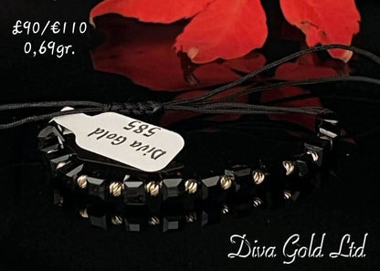 Black thread bracelet with 585 gold details. 0.69gram