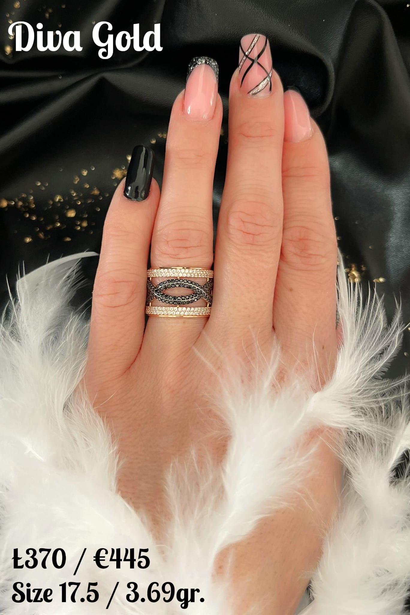 Gold ring with white&black zircon stones.  Size 17.5