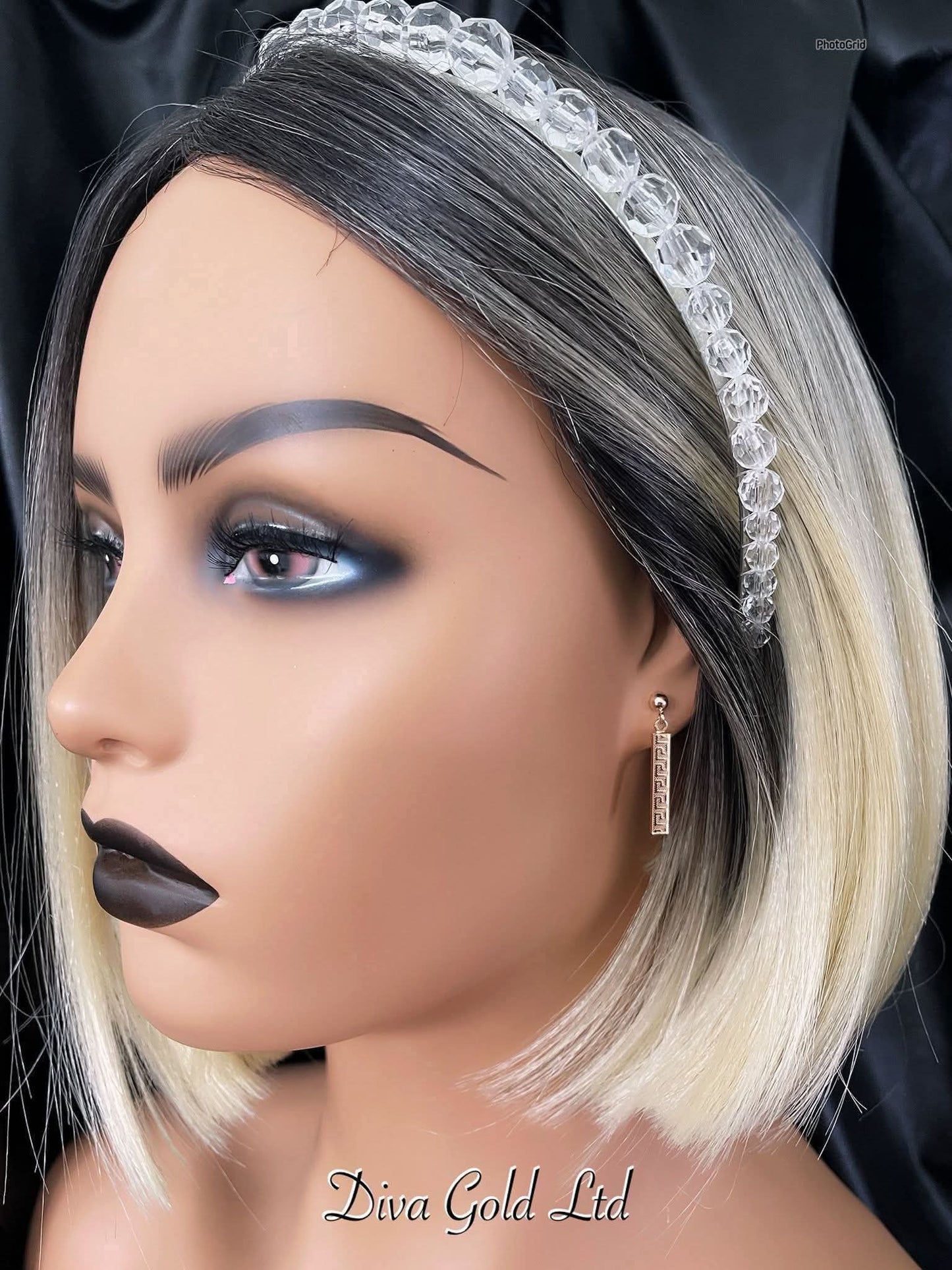 Stud gold earrings.