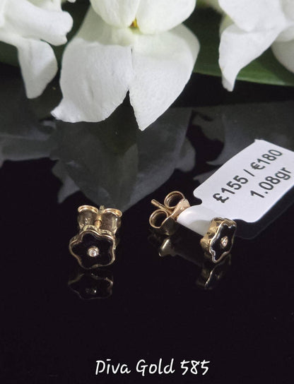 Stud gold earrings.