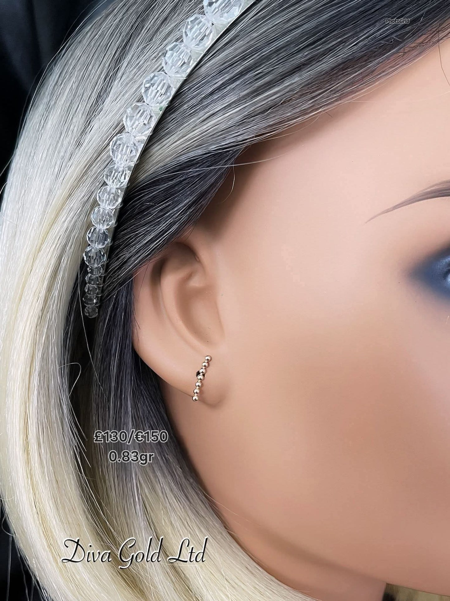 Stud gold earrings.