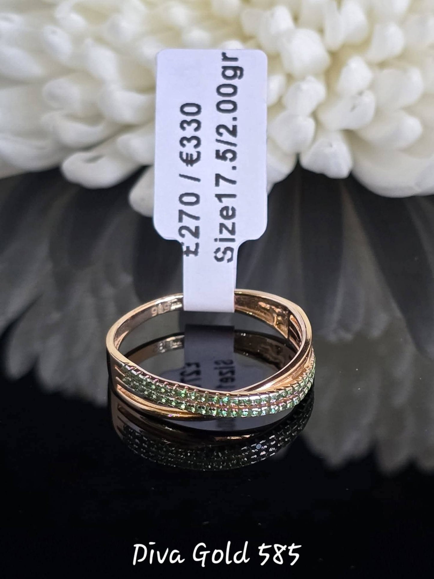 Gold women ring with green zircon stones.Size 17.5