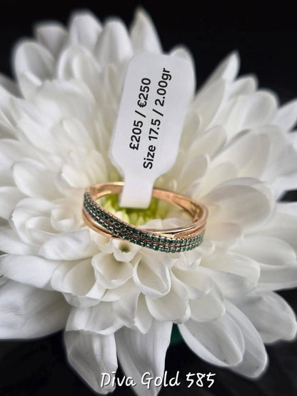 Gold ring with green zircon stones. Size 17.5