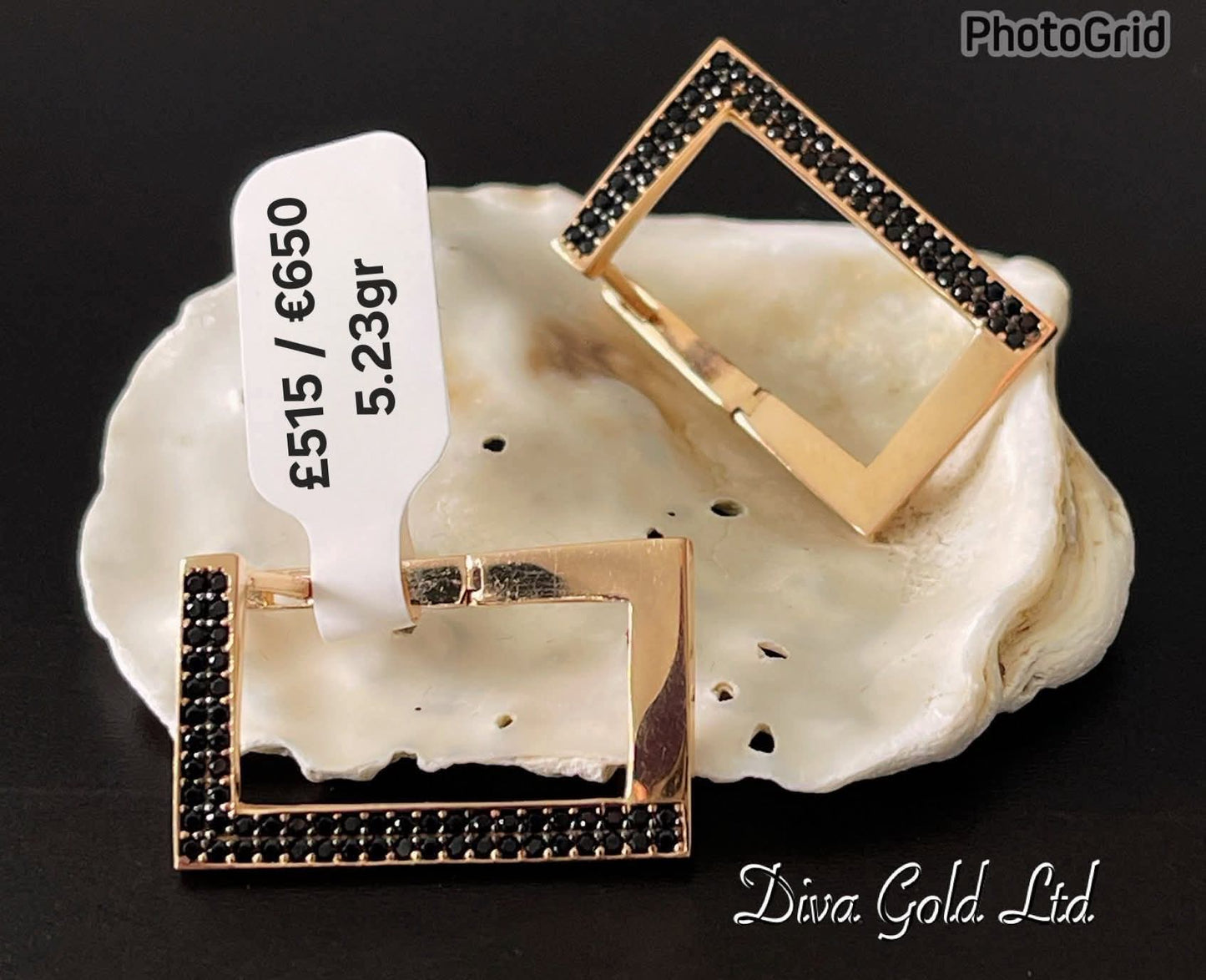 Gold 585 earrings with black zircon stones.