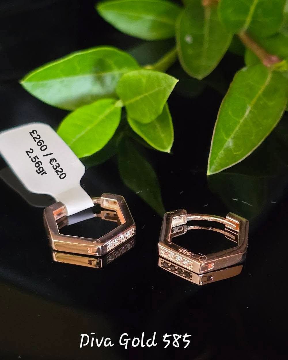 Gold 585 earrings with zircon stones.