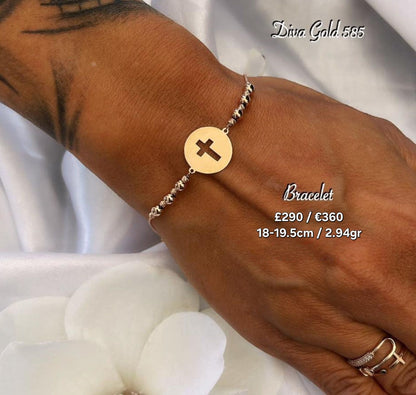 Gold bracelet with cross pendant. 18-19.5cm