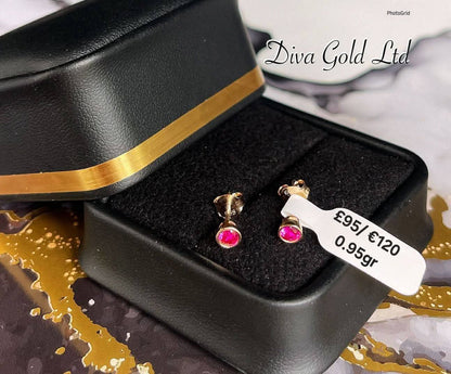 Gold 585 studs earrings with pink zircon stones.