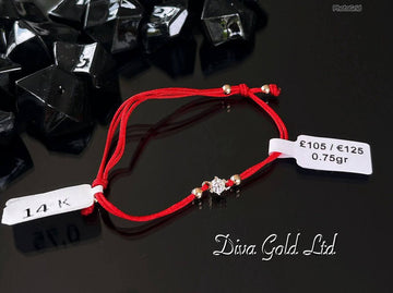 Red thread bracelet with 585 gold details. 0.75gram