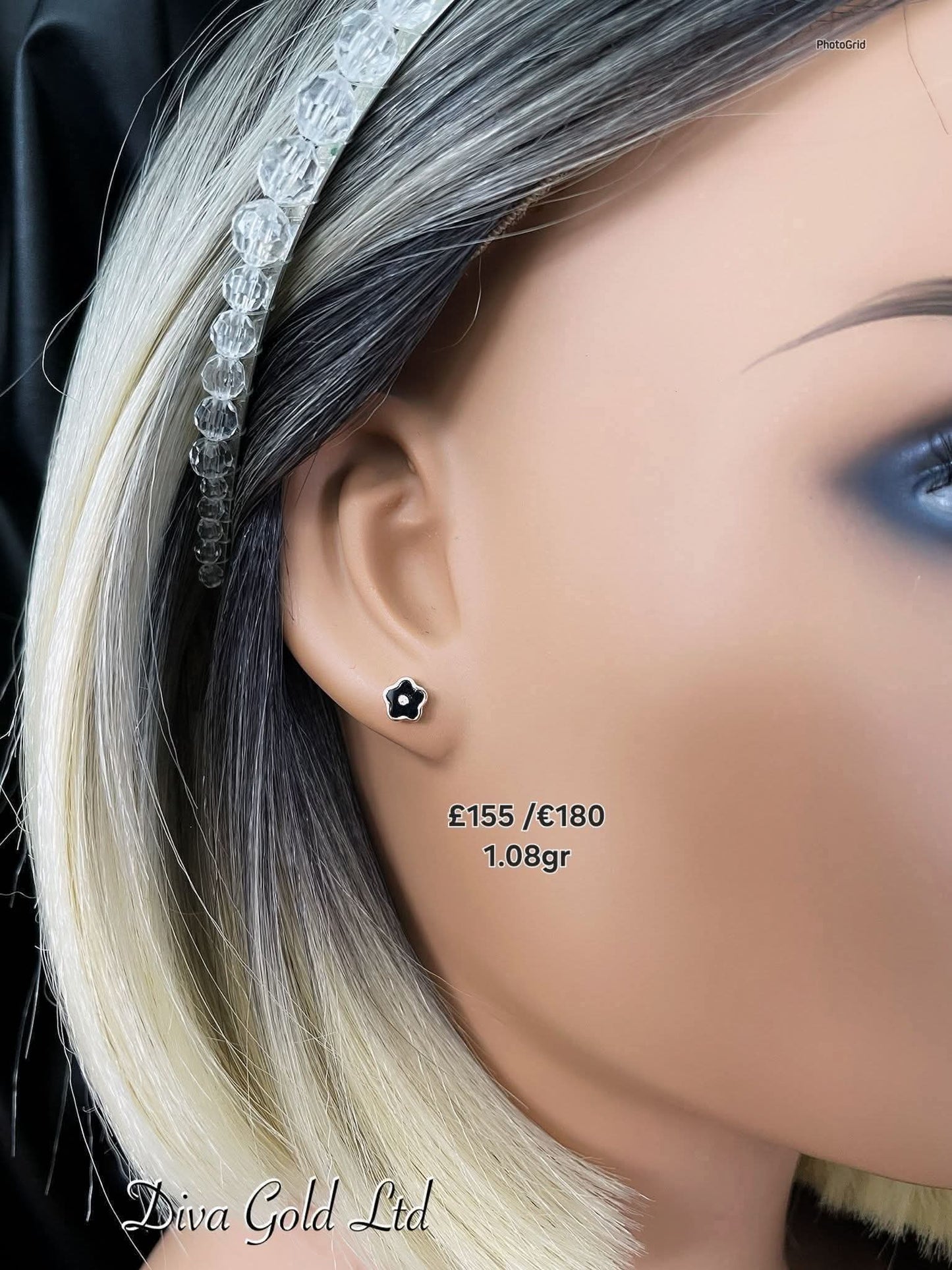 Stud gold earrings.