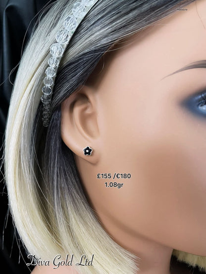 Stud gold earrings.