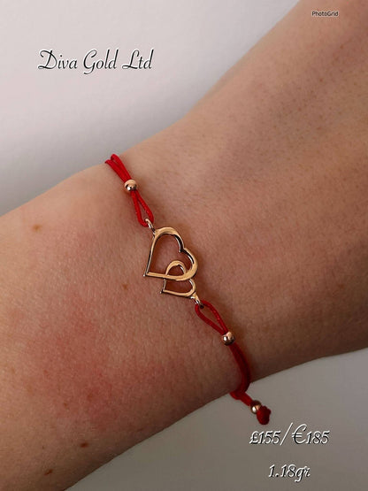 Red thread bracelet with 585 gold details. 1.18gram