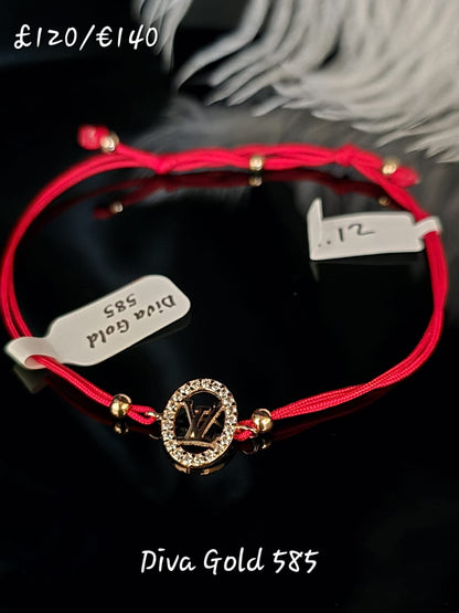 Red LV thread bracelet with gold details.