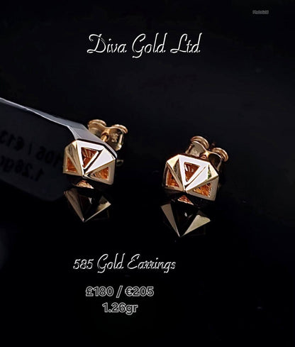 Stud gold earrings.