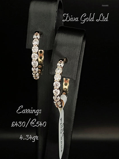 Gold 585 earrings with zircon stones.