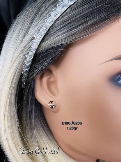 Stud gold earrings.