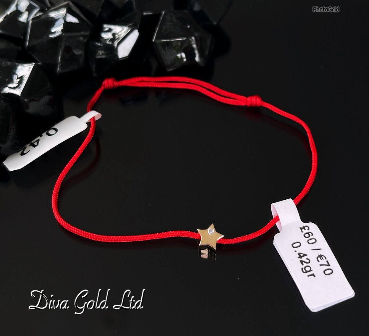 Red thread bracelet with 585 gold details. 0.42gram