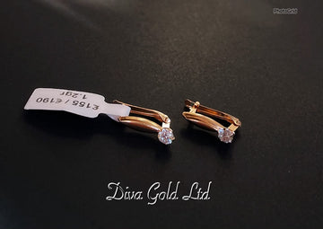 585 Gold earrings. 1.20gr