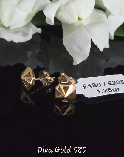Stud gold earrings.