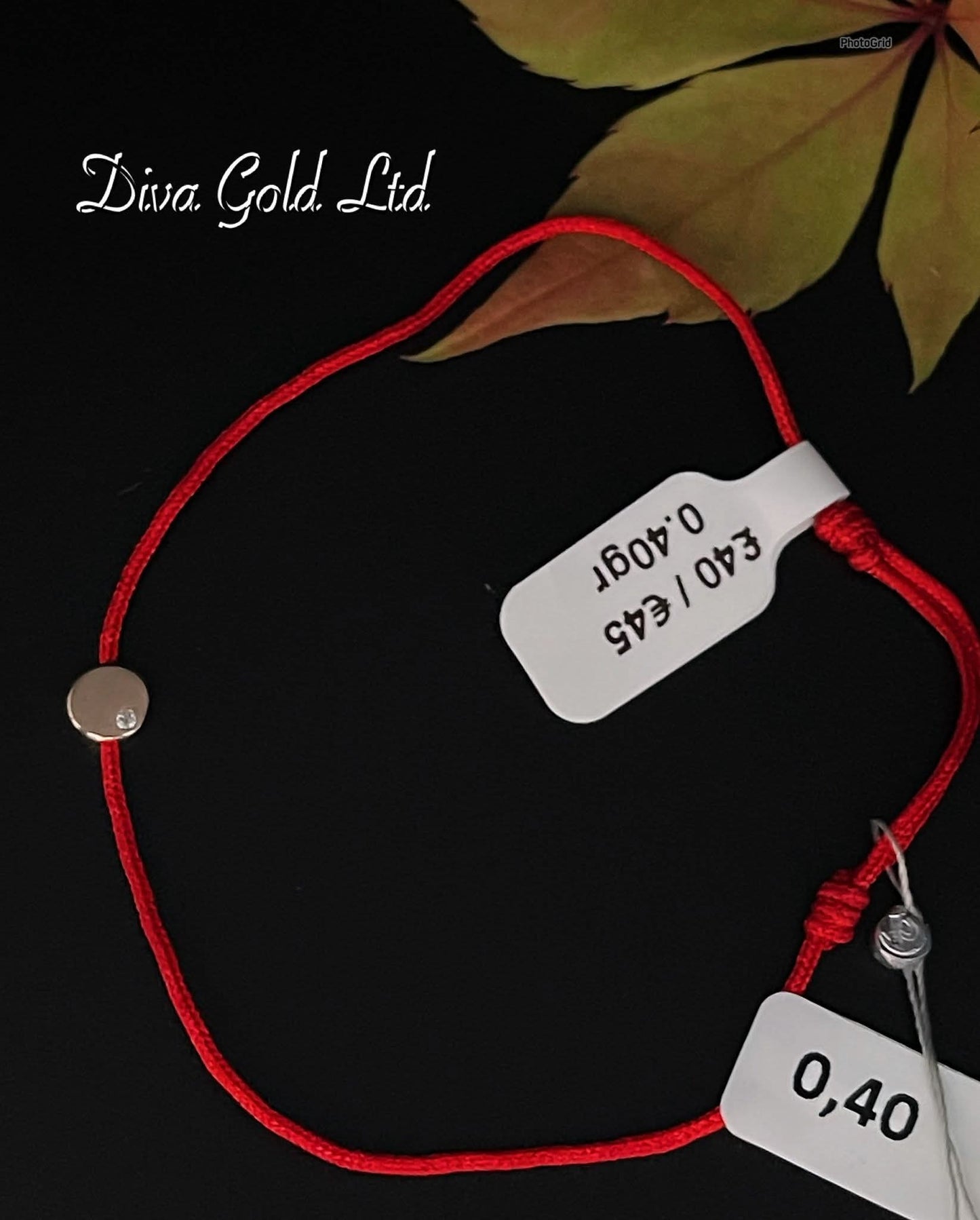 Red thread bracelet with gold details.