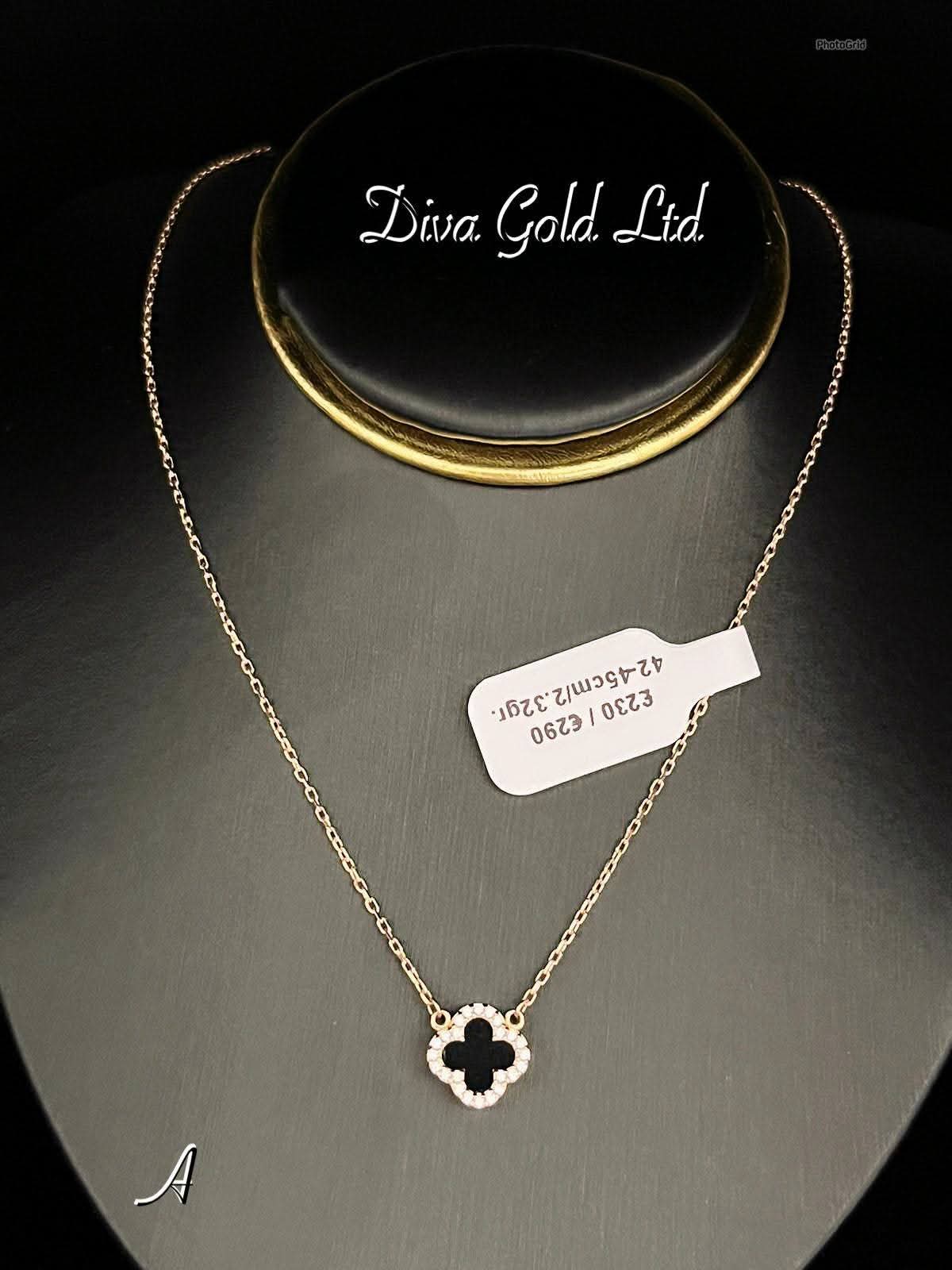 Gold chain with black pendant clover and white zircon stones. 42-45cm