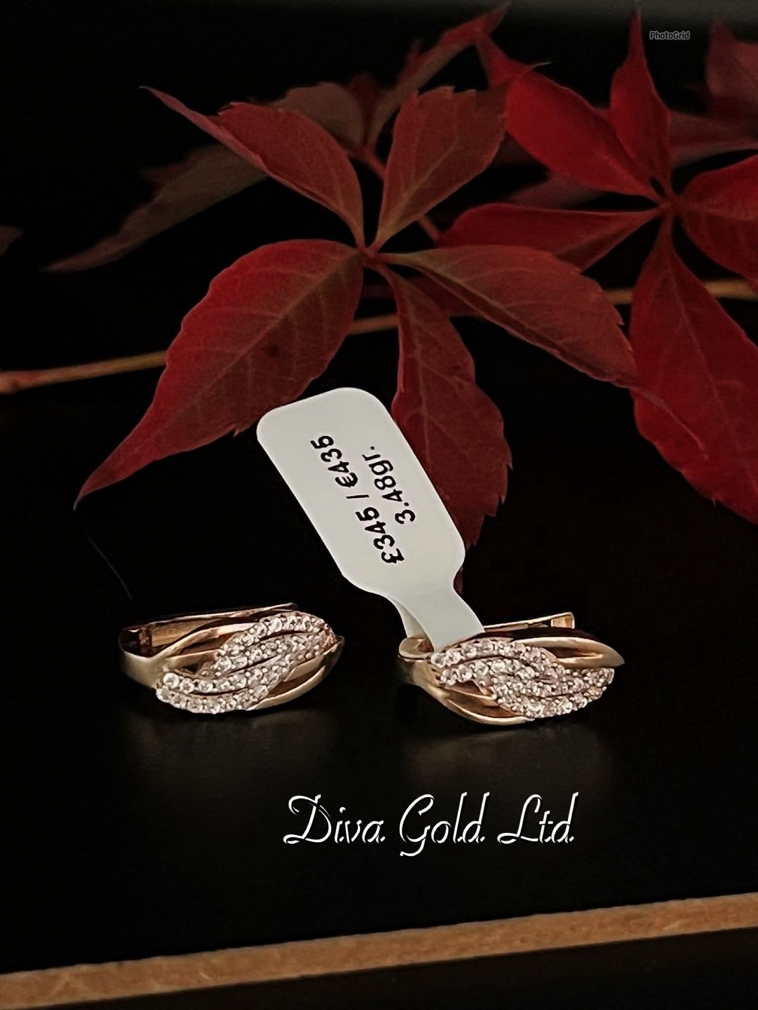 Gold 585 earrings with white zircon stones.