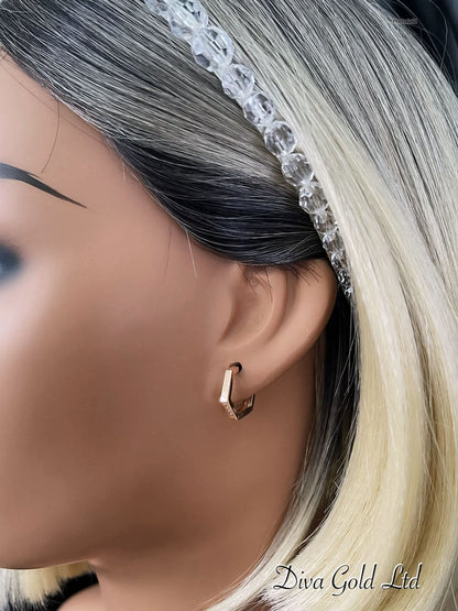 Gold 585 earrings with zircon stones.