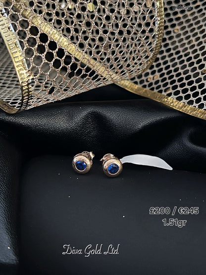 Stud gold earrings. Blue zircon stones