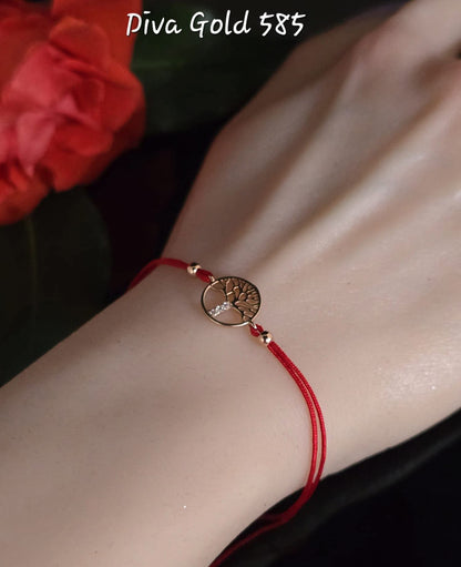 Red thread bracelets with 585 gold details.