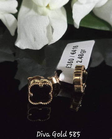Stud black clover gold earrings.
