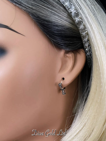 Gold 585 earrings with black rizcon stones.