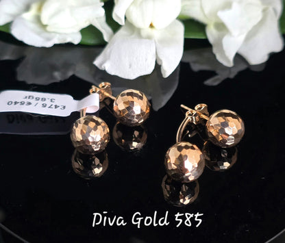 Stud gold earrings.