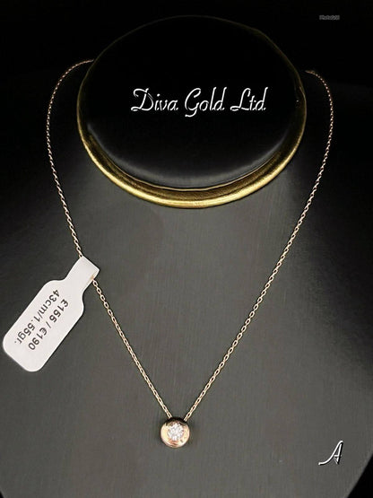 Gold chain with zircon stone pendant. 43cm