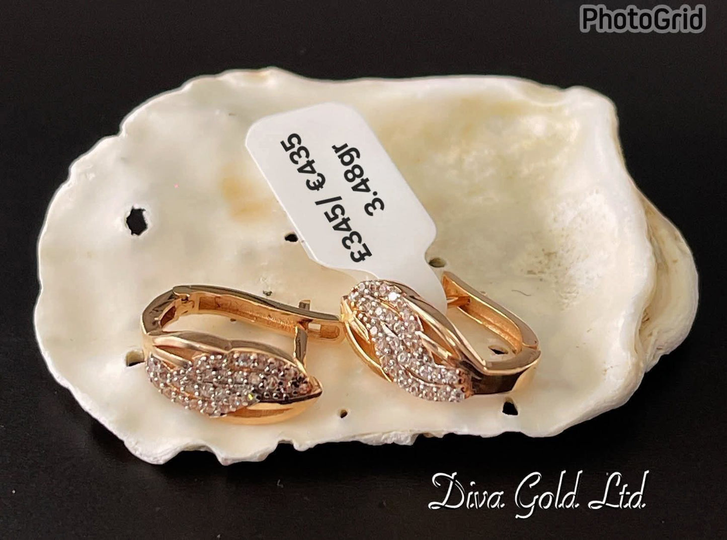 Gold 585 earrings with white zircon stones.