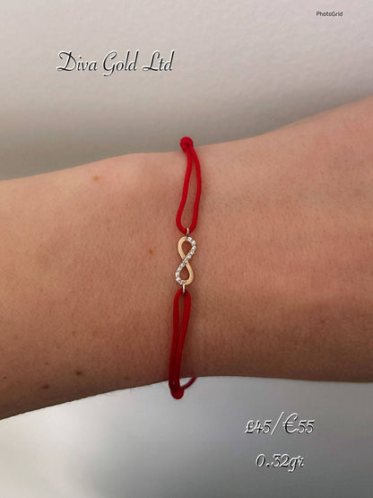 Red thread bracelet with 585 gold details. 0.32gram