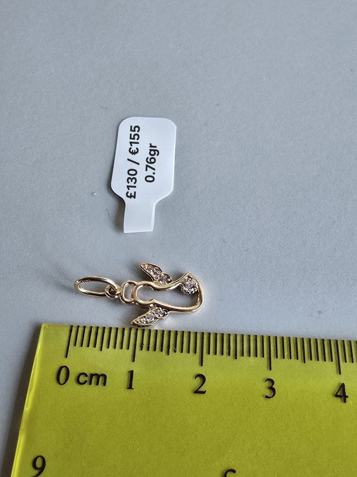 585 Gold Angel pendant. 0.76gr