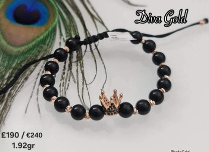 Black thread bracelet with gold details.