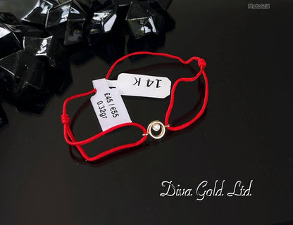 Red thread bracelet with 585 gold details.0.32gram