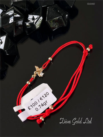 Red thread bracelet with 585 gold details. 0.74gram