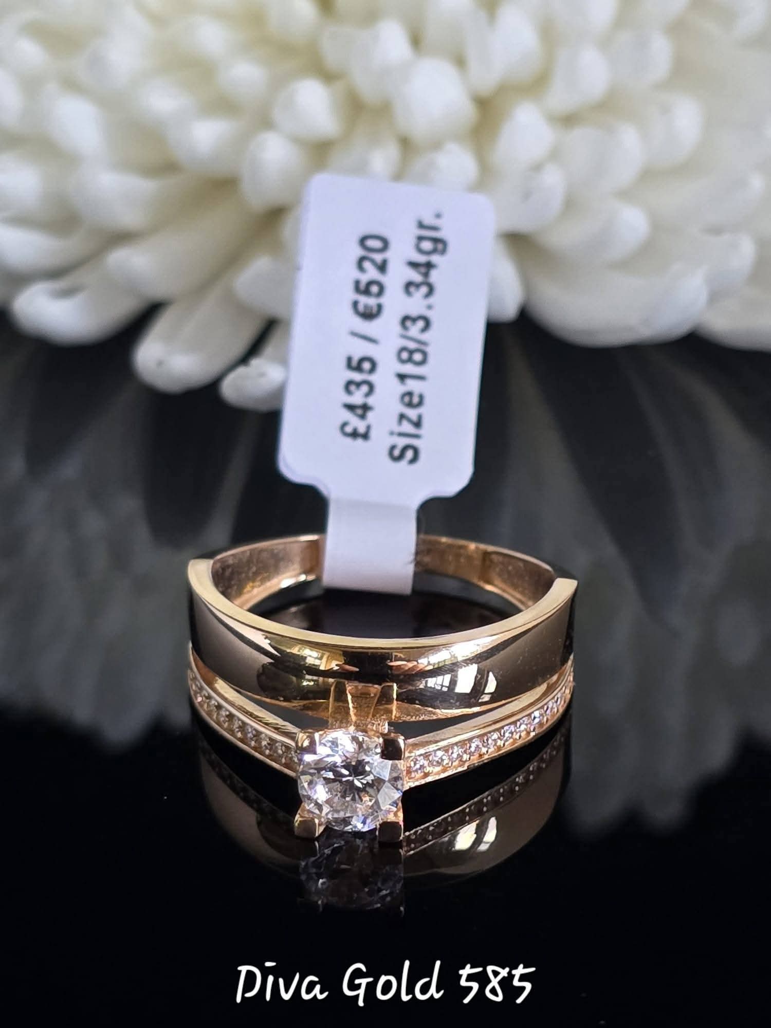 Gold women ring with white zircon stones. Size 18
